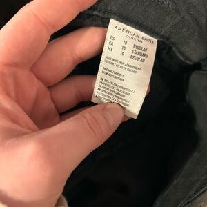 High waisted black distressed skinny jeans